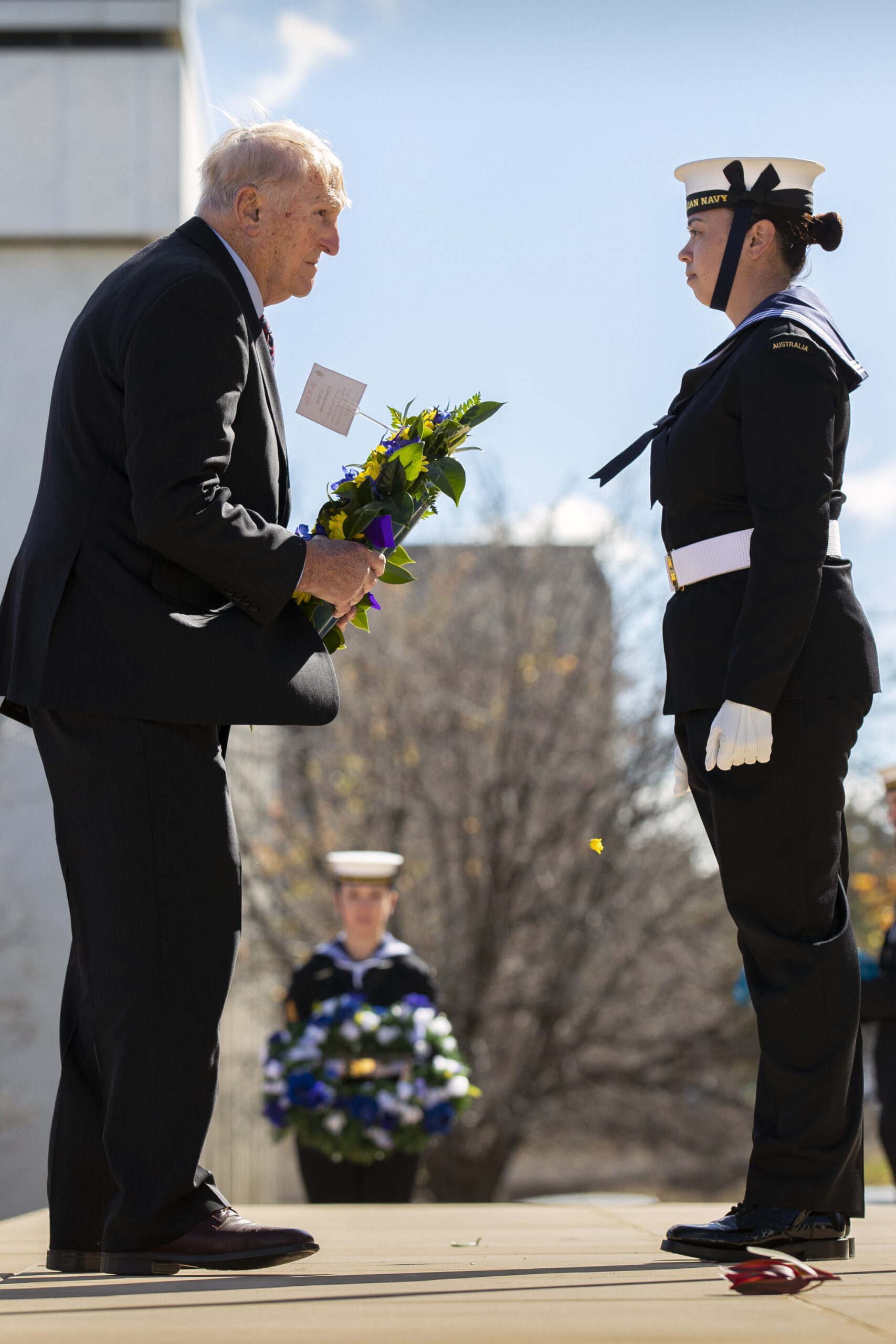 Mr Peter Radtke receives a wreath on behalf of Mr Derek Holyoake during a ceremony to commemorate the 79th anniversary of the Battle of the Coral Sea at Russel Offices, Canberra.  *** Local Caption *** The Minister for Defence Industry the Honourable Melissa Price MP, invited American Japanese and Australian dignitaries and Australian Defence Force personnel to commemorate the 79th anniversary of the Battle of the Coral Sea (4  8 May 1942) at the Australian-American memorial in Field Marshall Sir Thomas Blamey Square, Canberra on Friday the 14th of May 2021. 

The ceremony commemorated a decisive naval battle of the Second World War, where Australian and American naval forces and aircraft halted the advance of the Imperial Japanese Navy and their attempt to capture the then Australian protectorate of Papua. 

The battle was the first naval action between aircraft carriers, with the USS Lexington and USS Yorktown supported by Australian and American cruisers: HMAS Australia, HMAS Hobart and USS Chicago.