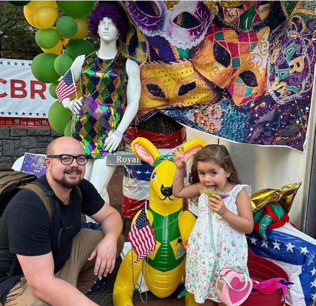 Man and daughter posing for photo